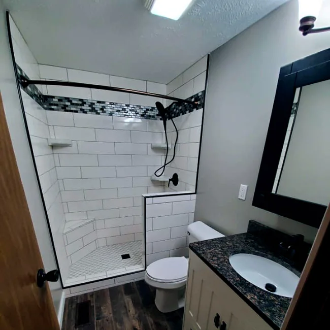 front-view-of-a-remodeled-bathroom-with-tile-wall-and-new-flooring-syracuse-in